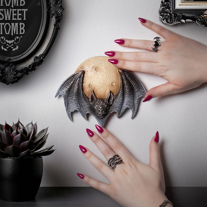 Full Moon and Flying Bat Statue