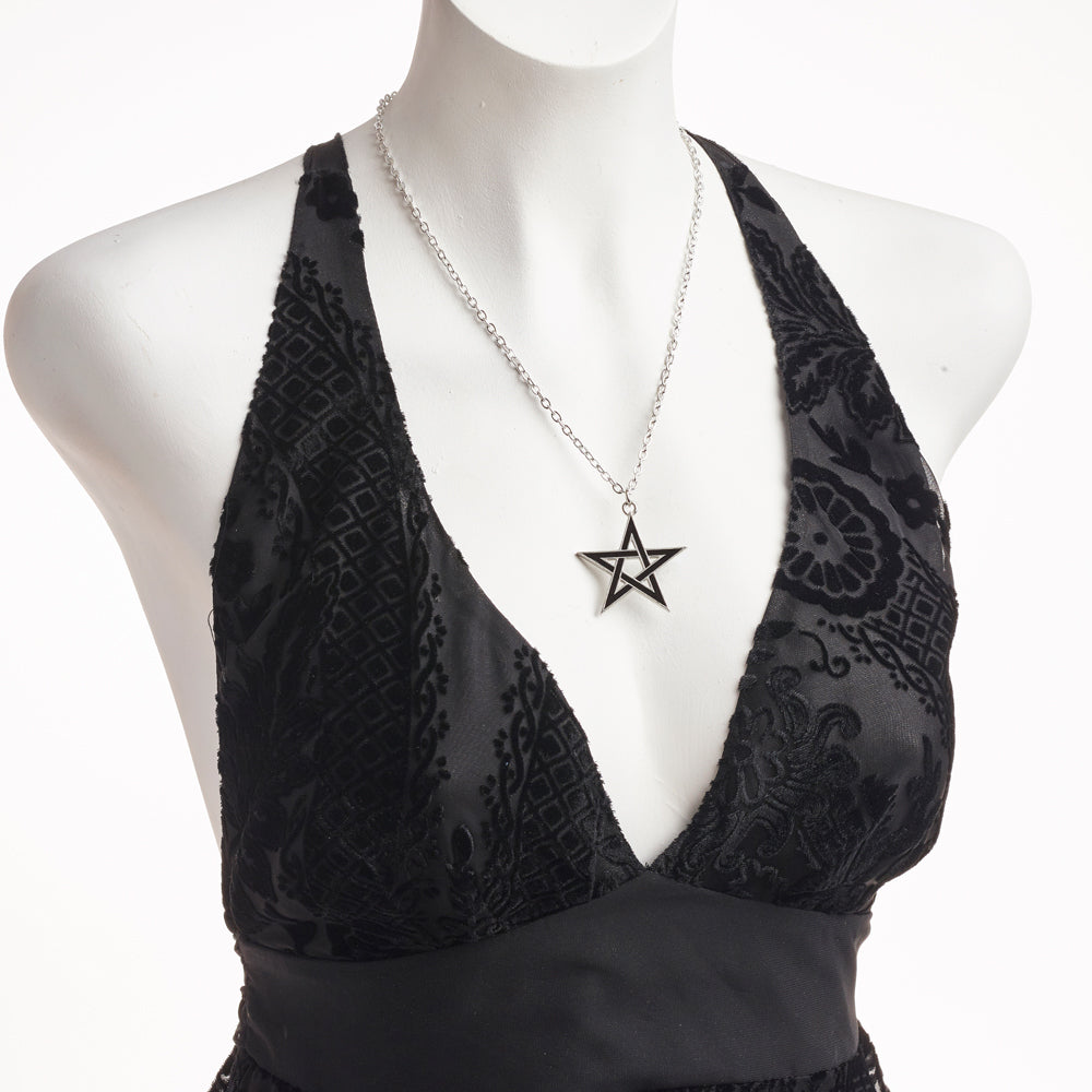 Black Star Pendant on a woman