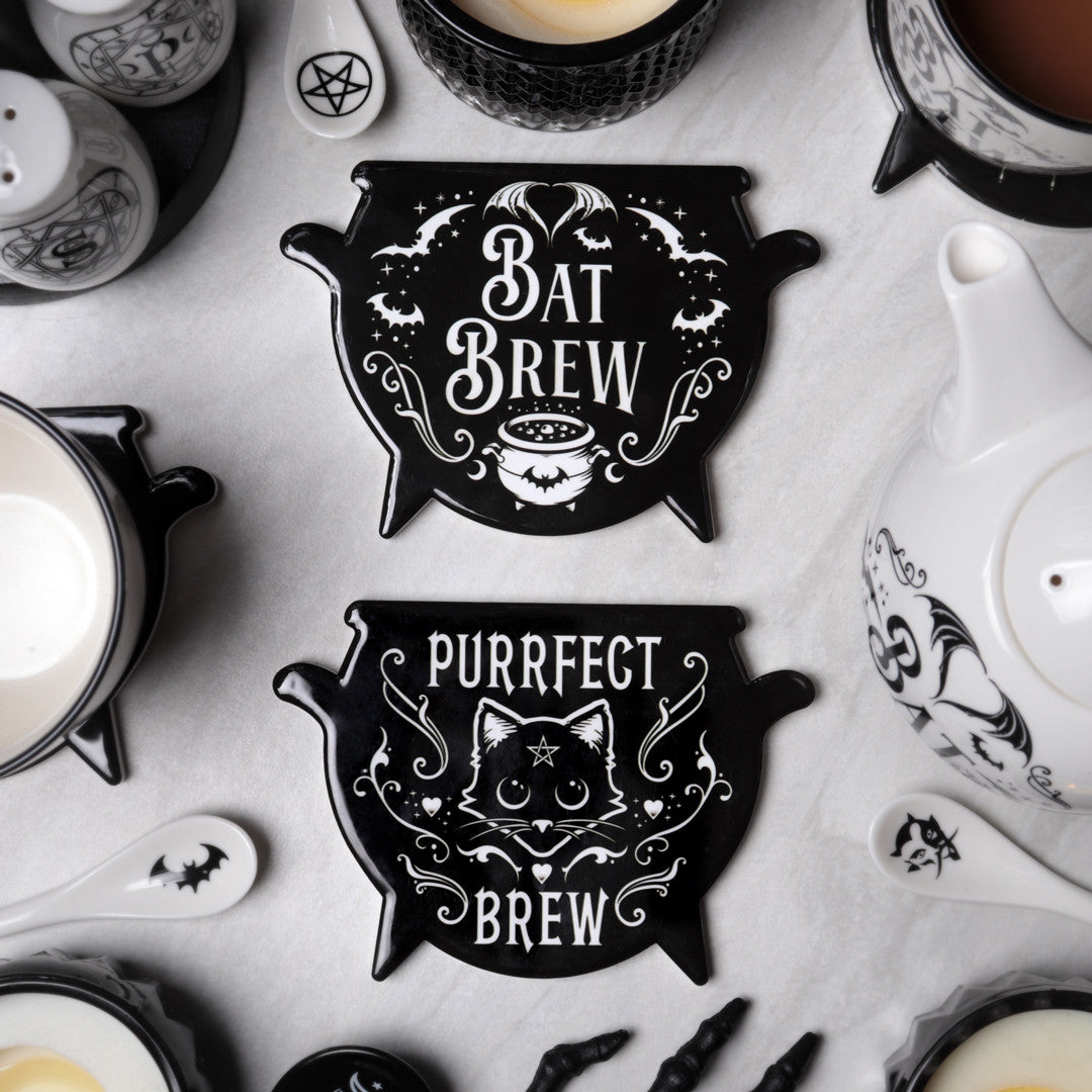 Purrfect Brew Cauldron Coaster on a table
