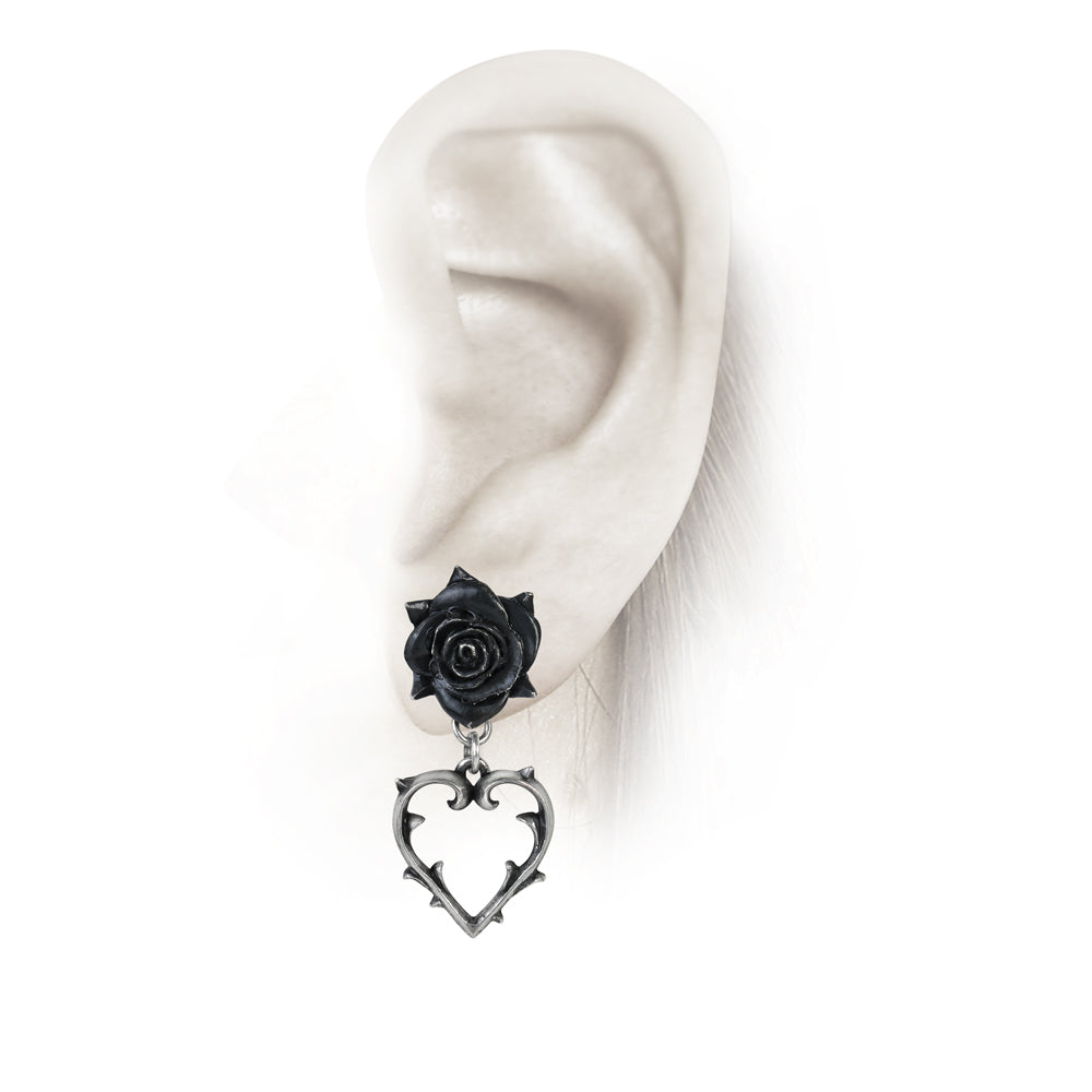 Rose And Thorn Heart Earrings on a ear