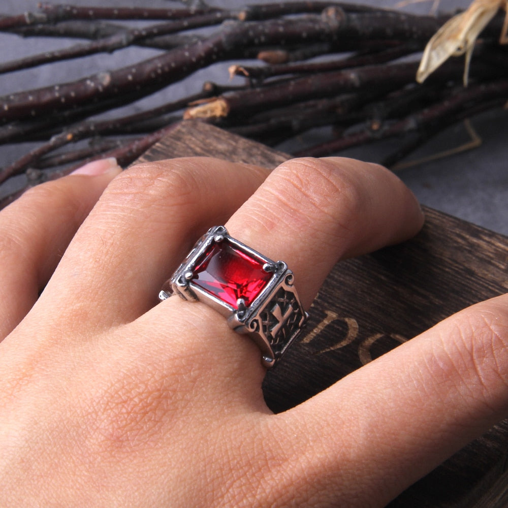 Gothic Cross With Red Gem Ring On A Hand