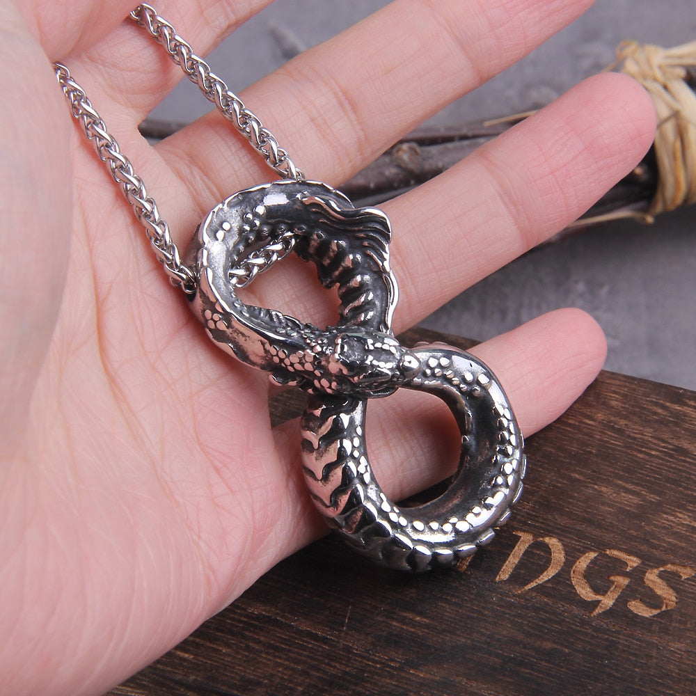Ouroboros Necklace being held